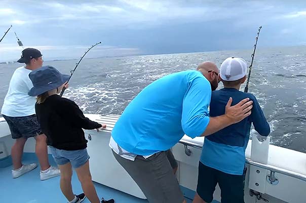 Family fishing together in Destin, Florida.